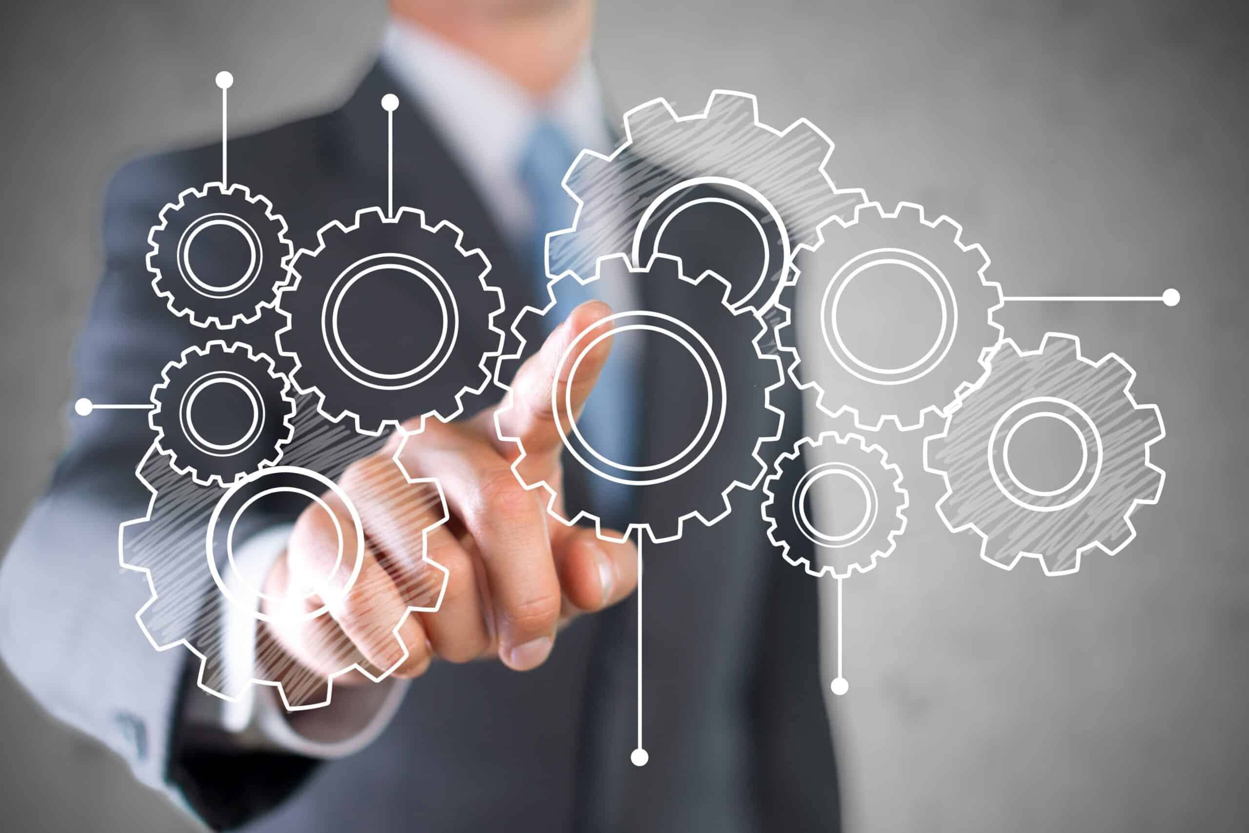 businessman and analytics symbols on grey background